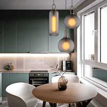 Load image into Gallery viewer, Smoky Glass Pendant Lights above kitchen table