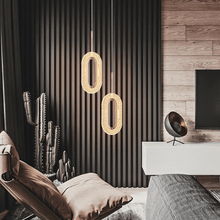 Load image into Gallery viewer, Diamond Style Pendant Light model B above chair in bedroom
