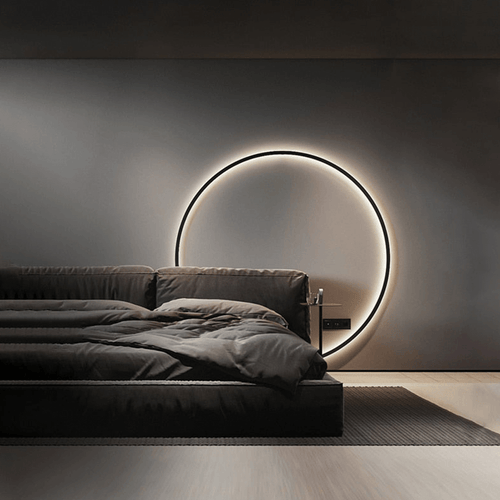 Minimalist LED Ring Light behind bed on bedroom wall