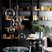 Load image into Gallery viewer, Nordic Glass Pendant Lights above coffee table in home office