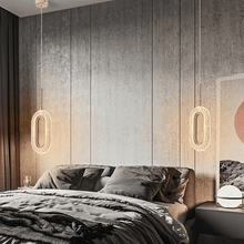 Load image into Gallery viewer, Diamond Style Pendant Light hanging above bedside table