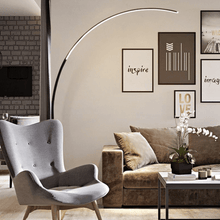 Load image into Gallery viewer, Black Nordic Arc Floor Lamp overlooking sofa in living room with armchair