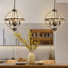 Load image into Gallery viewer, Two Industrial Metal Farmhouse Chandeliers hanging above kitchen island