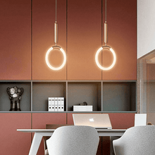 Load image into Gallery viewer, Two Nordic Shaped Pendant Lights above living room table with laptop on