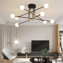 Load image into Gallery viewer, Black & Gold LED Chandelier in living room