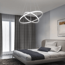 Load image into Gallery viewer, White LED Ring Chandelier above bed in bedroom