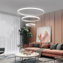 Load image into Gallery viewer, White LED Ring Chandelier above coffee table in living room