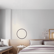 Load image into Gallery viewer, Black LED Single Ring Pendant Light above bedside table
