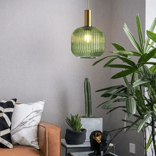 Load image into Gallery viewer, Green Nordic Coloured Glass Pendant Light in living room above plant table
