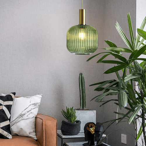 Green Nordic Coloured Glass Pendant Light in living room above plant table