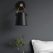 Load image into Gallery viewer, Black Nordic Wooden Hanging Wall Lamp above bedside table next to sofa
