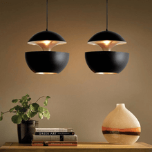 Load image into Gallery viewer, Black Modern Globe Pendant Lights above cabinet countertop
