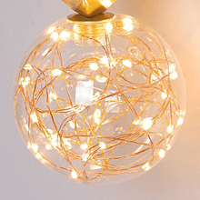 Load image into Gallery viewer, Close-up of Gold Globe String Pendant Light
