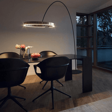 Load image into Gallery viewer, Black Creative Designer Ring Floor Lamp reaching over dining room table
