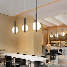 Load image into Gallery viewer, Black LED Thin Strip Full Circle Pendant Lights above dining room table

