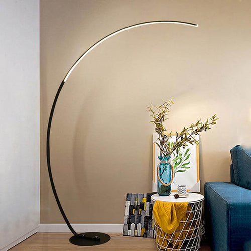 Black Nordic Arc Floor Lamp in the corner of living room