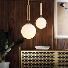 Load image into Gallery viewer, Gold Glass Ball Pendant Lamps above living room cabinet

