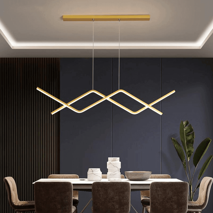Gold Oscillating Strip Chandelier above dining room table