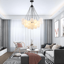 Load image into Gallery viewer, Black Frosted Glass Ball Chandelier in living room
