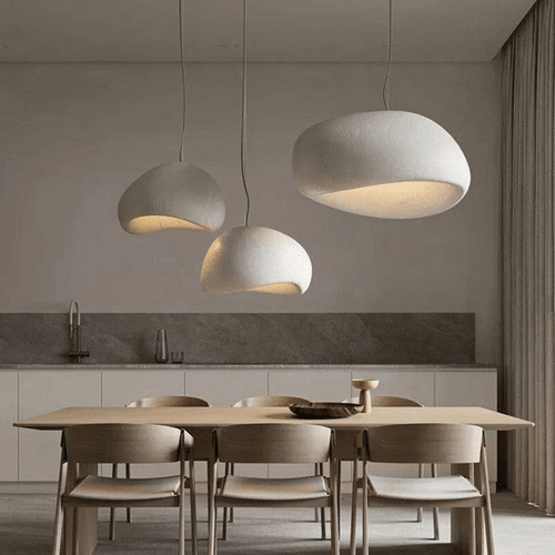 Three Japanese Style Pebble Pendant Lights above wooden kitchen table