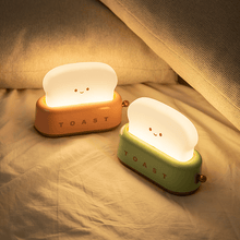 Load image into Gallery viewer, Two Bread Maker LED Night Lights on bed
