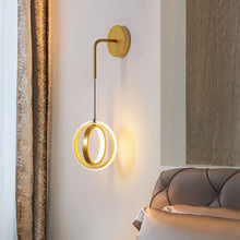 Load image into Gallery viewer, Gold Modern Luxury Ring Wall Light on bedroom wall next to bed
