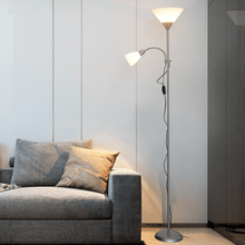 Load image into Gallery viewer, Silver Two-Headed Industrial Floor Lamp next to sofa in living room
