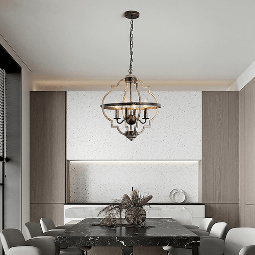 Industrial Metal Farmhouse Chandelier hanging above black marble dining table