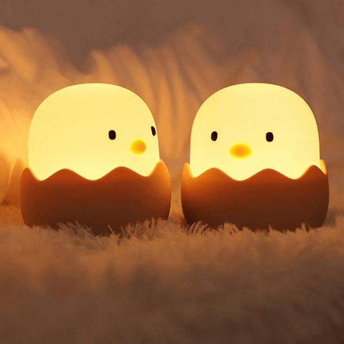 Two Cute Chick Night Lights on bed