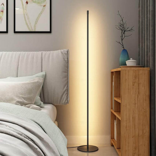 Minimalist LED Floor Lamp next to bed in bedroom