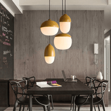 Load image into Gallery viewer, Four Modern Acorn Pendant Lamps above classroom table
