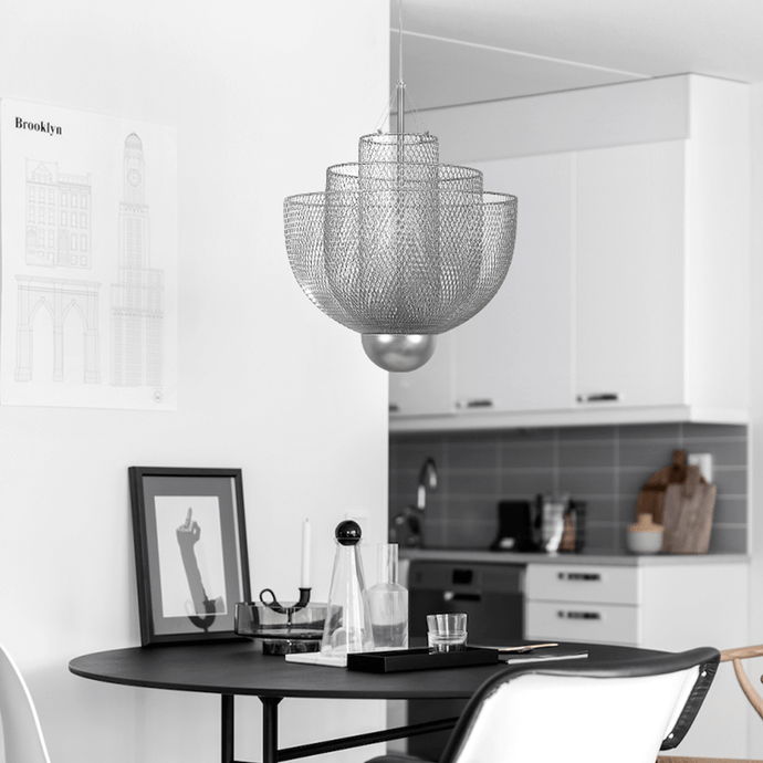 Modern European Metal Chandelier above black dining table