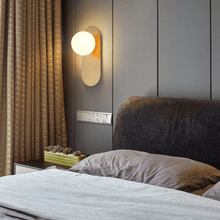 Load image into Gallery viewer, Gold Flat Base Globe Light above bedside table next to bed
