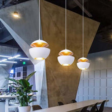 Load image into Gallery viewer, Three white Modern Globe Pendant Lights above restaurant table
