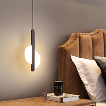 Load image into Gallery viewer, Black LED Thin Strip Half Circle Pendant Light above bedside table
