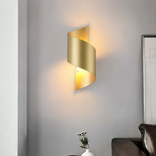 Load image into Gallery viewer, Gold Spiral Wall Light on living room wall above sofa
