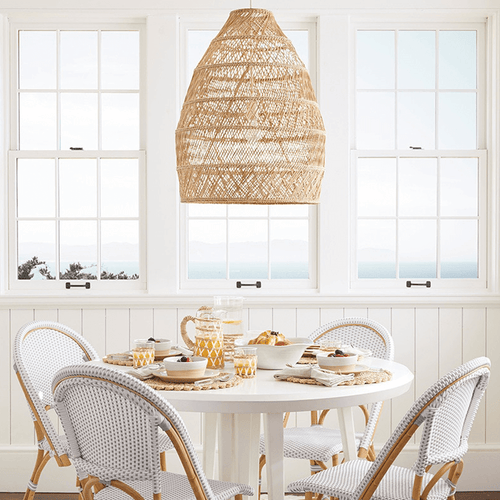 Modern Chinese Wicker Ceiling Light above white dining table