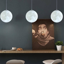 Load image into Gallery viewer, Three Moon Pendant Lights above dining table attached to wall
