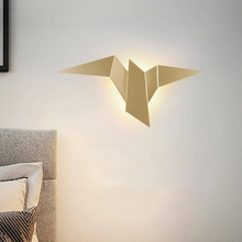 Load image into Gallery viewer, Gold Metallic Bird Wall Light on bedroom wall
