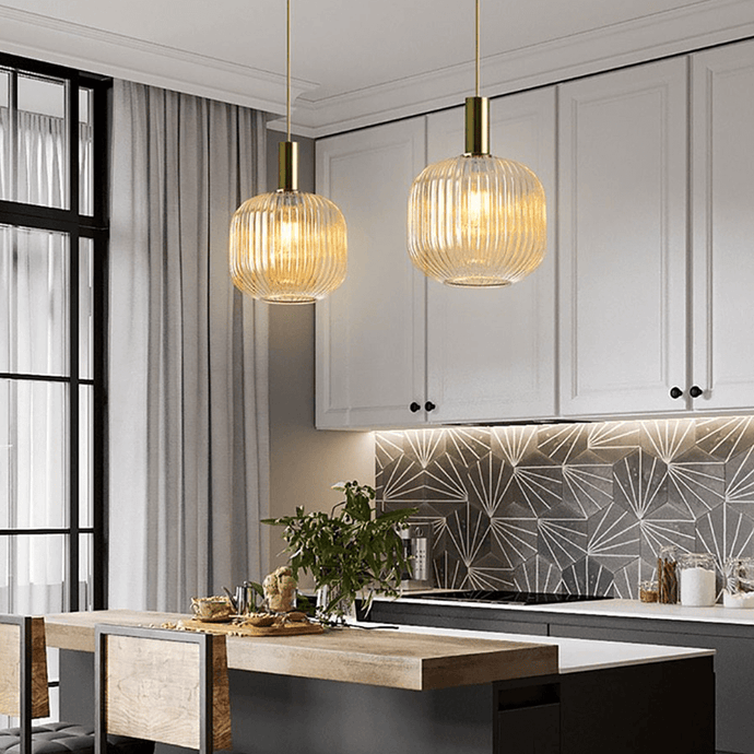 Two Nordic Coloured Glass Pendant Lights in cognac colour above kitchen island