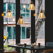 Load image into Gallery viewer, Four Vintage Glass Pendant Lights above restaurant table
