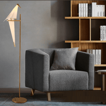 Load image into Gallery viewer, Minimalist Bird Floor Lamp next to armchair in living room
