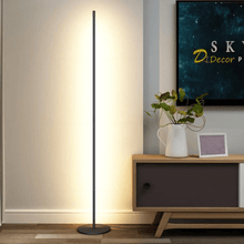 Load image into Gallery viewer, Minimalist LED Floor Lamp next to TV stand in living room
