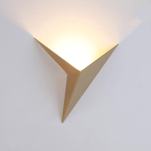 Load image into Gallery viewer, Gold Modern Triangular Wall Light with light on
