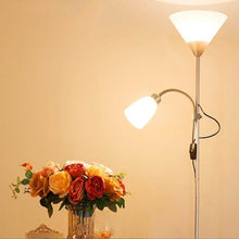 Load image into Gallery viewer, Silver Two-Headed Industrial Floor Lamp next to table with flowers on
