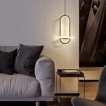Load image into Gallery viewer, Black Scandinavian LED Pendant Light above coffee table next to sofa in living room
