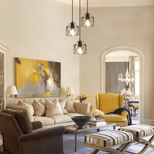 Load image into Gallery viewer, Scandinavian Triple Lamp Chandelier on living room ceiling above coffee table, sofa and armchairs
