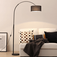Load image into Gallery viewer, Black Modern Essential Floor Lamp next to sofa in living room
