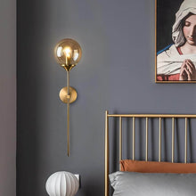 Load image into Gallery viewer, Modern Golden Glass Wall Lamp on wall next to bed
