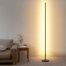 Load image into Gallery viewer, Minimalist LED Floor Lamp next to sofa in living room
